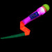 The Foxtail LED is a colorful light-up night toy with a green-rounded end, glowing pink body, and red-green ribbon, ideal for outdoor games and shown against a black background.